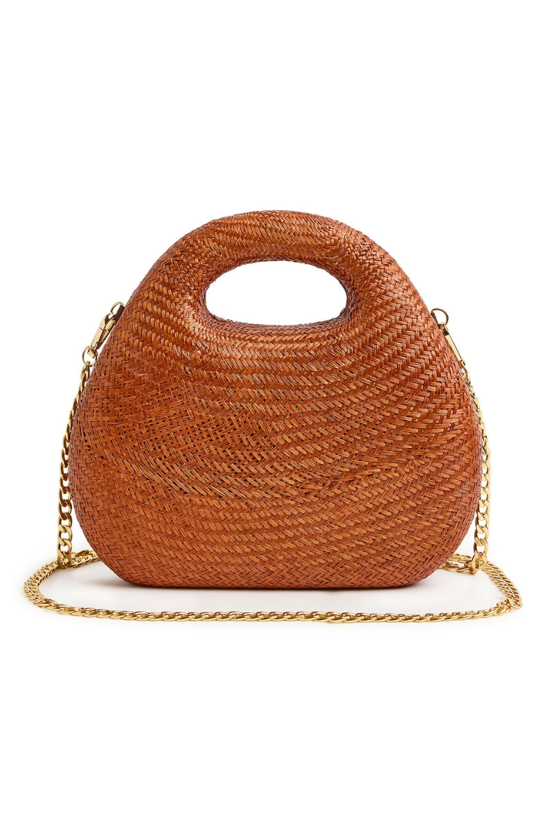 Emm Kuo Meadow Lane Rust top handle bag with structured silhouette and leather handle on a neutral background.
