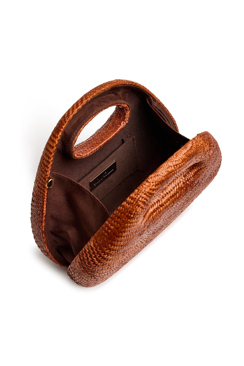 Emm Kuo Meadow Lane Rust top handle bag with structured design and leather details, shown in a close-up image.