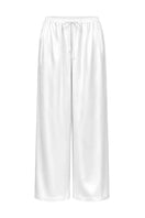 White Melanie Pants by Izakova, showcasing relaxed fit and stylish design in a natural fabric.