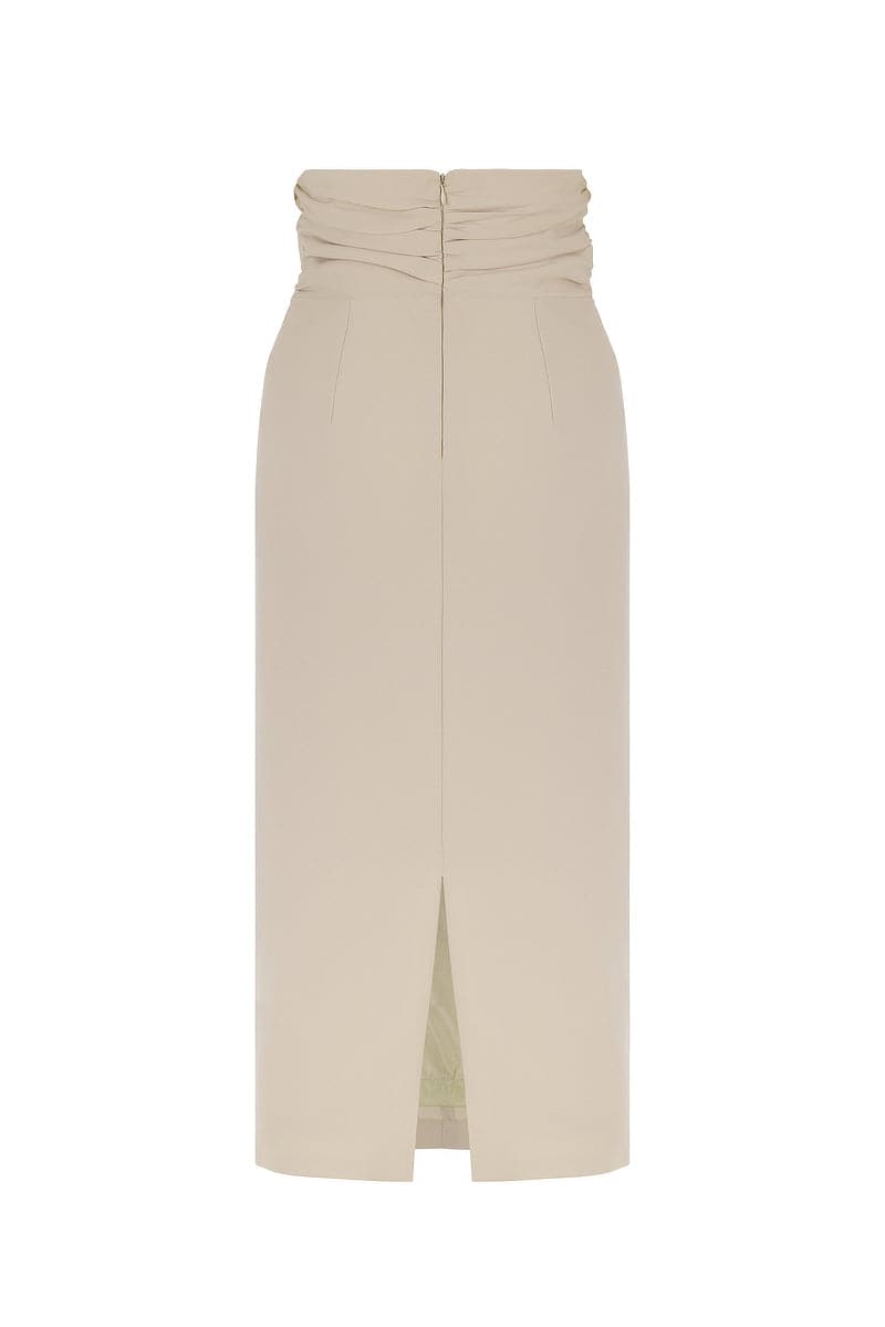 Back view of Mirel Prentice knot detail midi skirt showcasing its stylish design and flowing fabric.