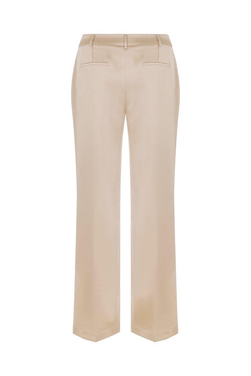 Back view of Mirel Prentice satin boyfriend pants showcasing low-rise fit and smooth, shiny satin fabric.