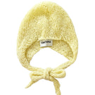 Hand-knitted yellow bonnet by Chictopia, showcasing a cozy, stylish hat with textured knit details and a snug fit.