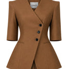 Brown NELA blazer by Izakova displayed on a hanger, showcasing tailored fit and classic blazer style.