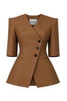 Brown NELA blazer by Izakova displayed on a hanger, showcasing tailored fit and classic blazer style.