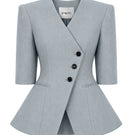 Izakova NELA blazer in washed blue, tailored fit with lapel collar and single-button closure, displayed on a hanger.