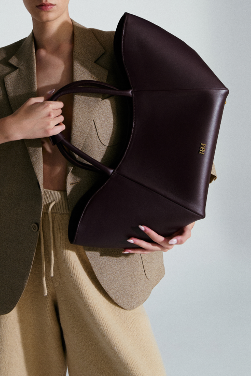 Rose de Mai Neroli Bag in Burgundy, a stylish top handle bag with deep plum color and elegant design.