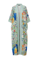 NiLuu Carmen kaftan cover-up in lightweight, flowing fabric, displayed in ghost color with intricate detailing.