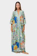 Light blue niLuu Carmen kaftan cover-up with flowing fabric and intricate embroidery, perfect for beach or resort wear.