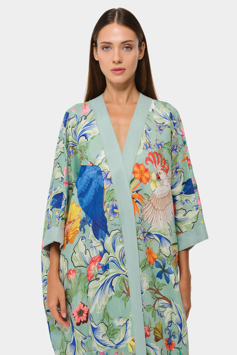 Light navy blue niLuu Carmen Kaftan cover-up with intricate embroidery and flowing fabric, perfect for beach or poolside wear.