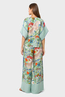 niLuu Carmen tie top, stylish women's blouse with tie-front detail, lightweight fabric, and short sleeves for a trendy look.