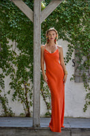 NiLuu Ember Scarlet Slip Dress, a stylish red maxi dress with a flowing silhouette and elegant design, perfect for chic occasions.