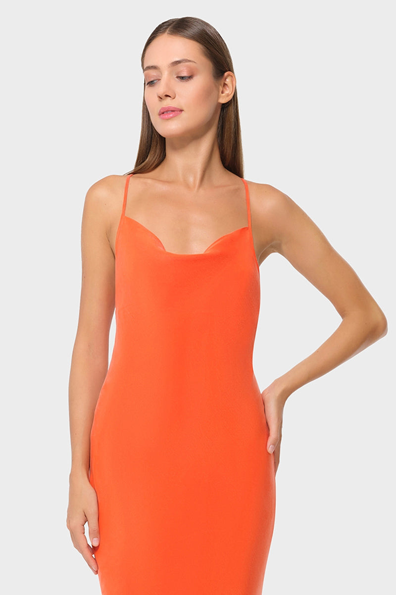 NiLuu Ember Scarlet slip dress, a stylish maxi dress with flowing fabric and elegant design, showcased in this image.