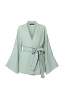 niLuu Jade Wrap Top, a stylish women's blouse with a flattering wrap design in a ghostly color.
