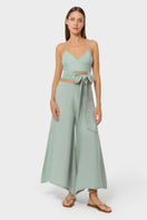 Light green niLuu jade palazzo pants with wide legs and relaxed fit, styled with a casual top for a chic, comfortable look.