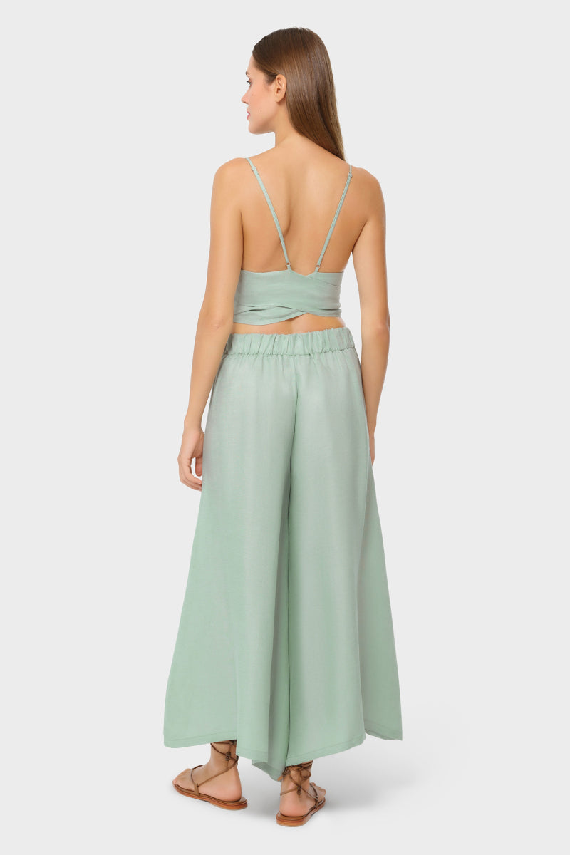 NiLuu jade palazzo pants with wide-leg design and lightweight fabric, shown in a stylish, relaxed fit.