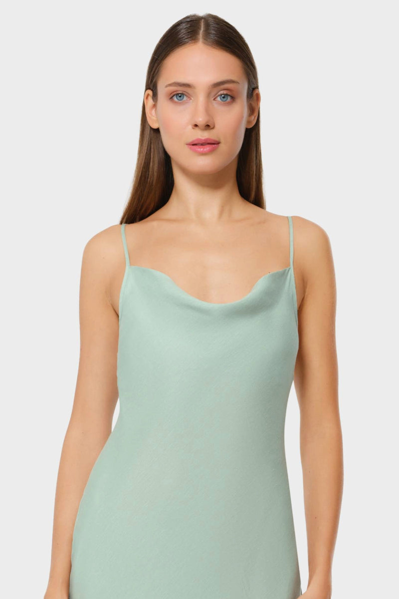 NiLuu Jade Scarlet slip dress, a stylish maxi dress with a flowing silhouette and vibrant color, perfect for elegant occasions.