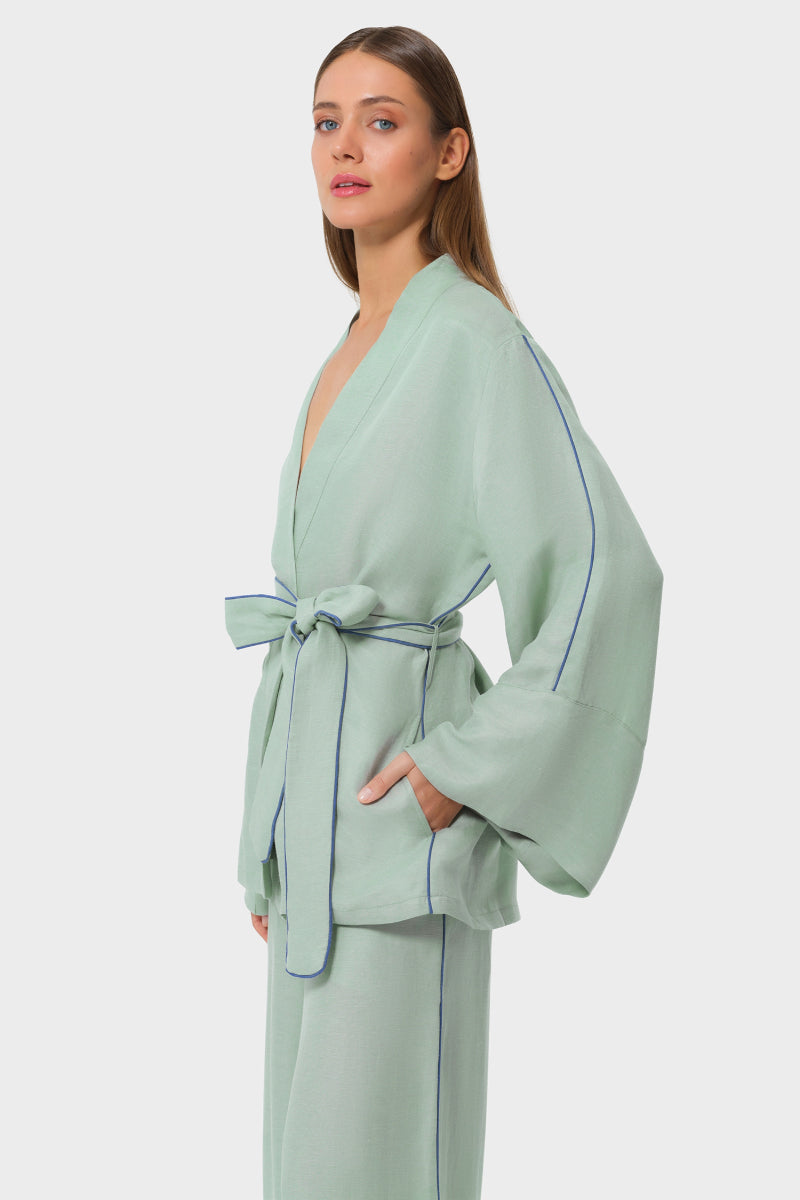 NiLuu Jade Wrap Top in soft fabric, featuring a stylish wrap design and long sleeves, perfect for casual or chic outfits.