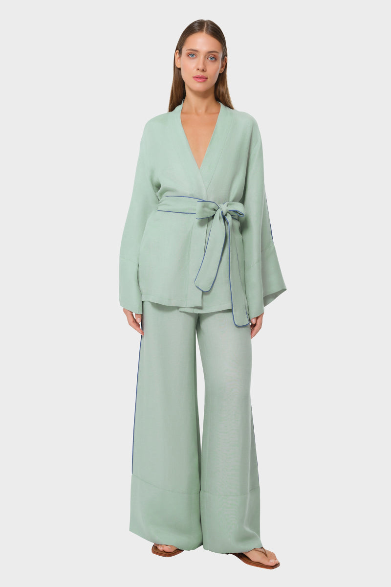 niLuu Jade Wrap Top, a stylish women's top with a sleek jade green fabric and elegant wrap design.