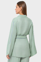 niLuu jade wrap top featuring a silky fabric and elegant design, perfect for stylish casual or dressy occasions.