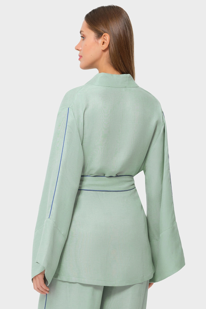 niLuu jade wrap top featuring a silky fabric and elegant design, perfect for stylish casual or dressy occasions.