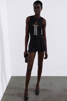 Black fringed bodysuit by SÉLONE featuring a fitted knit design and fringed detail, perfect as a stylish top or layering piece.