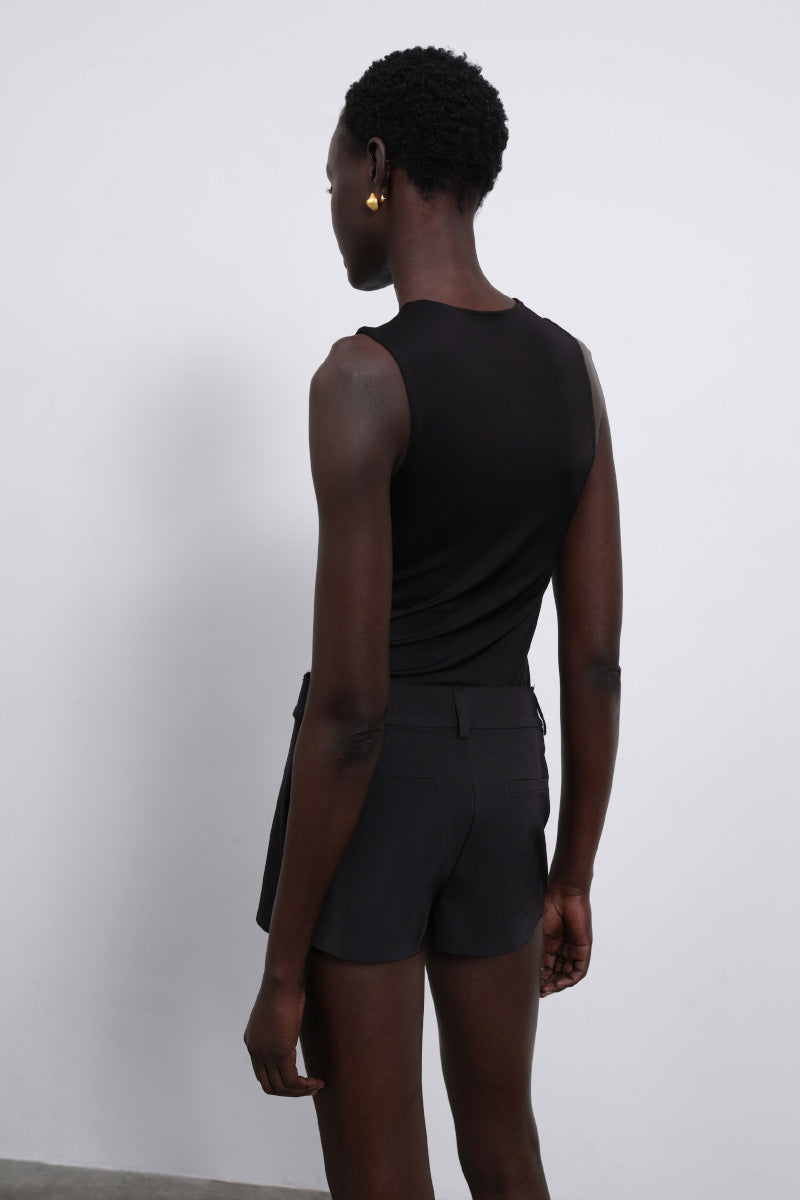 Black Nina fringed knit bodysuit by SÉLONE, featuring fringe detailing and a fitted top design.