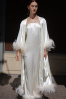 Ivory bride-to-be halter neck silk maxi dress with removable feathers, elegant and flowing, by Not Just Pajama.