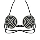 Black spiral optical bra by Nué, a stylish black tops piece with a unique spiral design visible on the front.