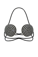 Black spiral optical bra by Nué, a stylish black tops piece with a unique spiral design visible on the front.