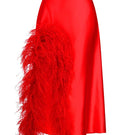Red Nué Cult Mia X Nué Studio Laetitia feather midi skirt displayed on a hanger with intricate feather detailing.