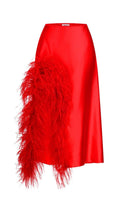Red Nué Cult Mia X Nué Studio Laetitia feather midi skirt displayed on a hanger with intricate feather detailing.