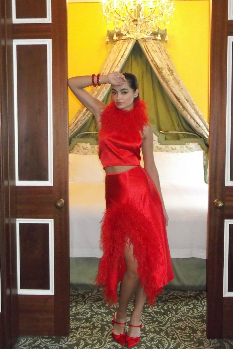 Red Cult Mia X Nué Studio Laetitia feather midi skirt, stylish and flowy with layered feather details.