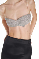 Nué Eternity Bra tops with crystal embellishments, featuring a sleek design and adjustable straps for a stylish fit.