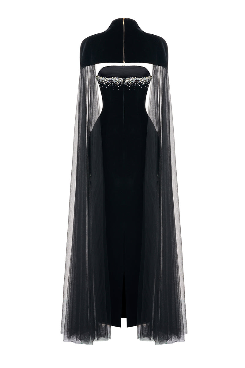 Black velvet gown with cape details by Happy Clothing, featuring a flowing silhouette and elegant design.
