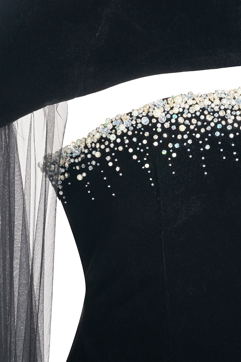 Elegant black velvet gown with cape details by Happy Clothing, featuring a flowing silhouette and luxurious fabric.