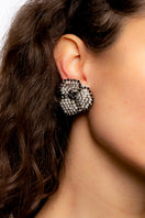 Silver Lil Camelia earrings by Silvia Gnecchi featuring delicate floral design and elegant dangle style.