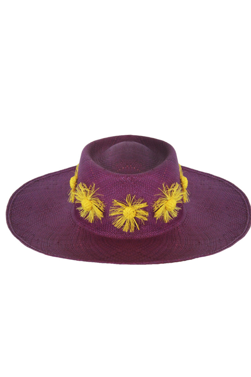 Purple Dia de Sol hat by Pájara Pinta featuring a wide brim and woven design, perfect for sunny days.