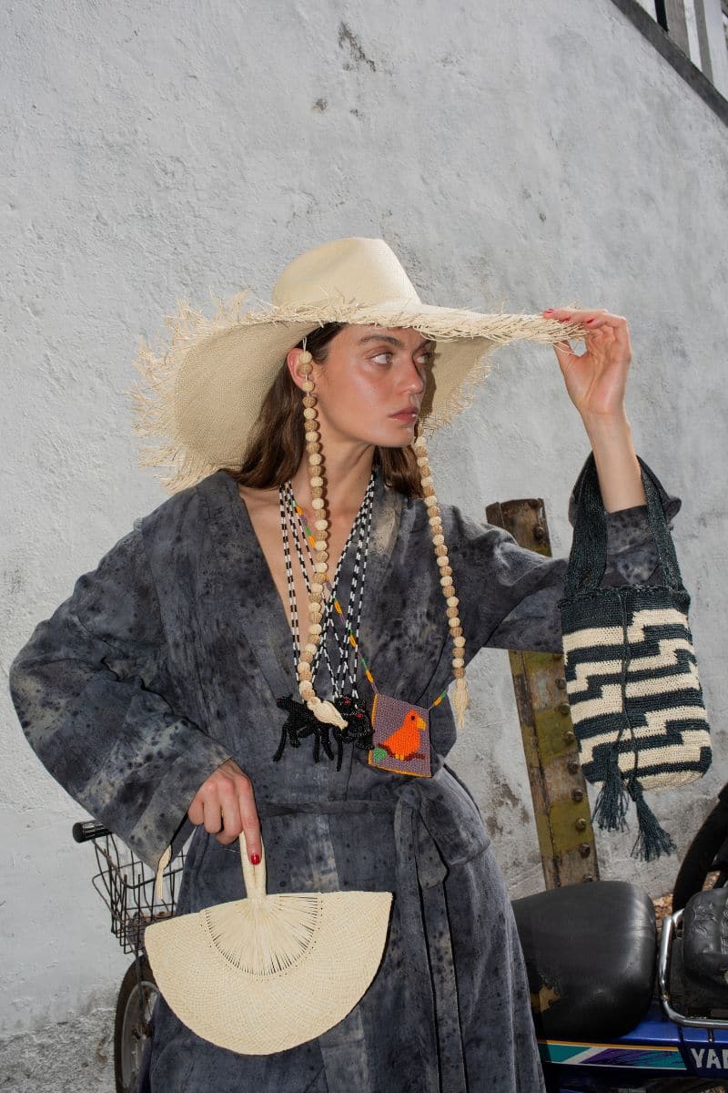 Venus Iraca Palm Sun Hat by Pájara Pinta, natural and white wide-brim straw hat for sun protection and beachwear.
