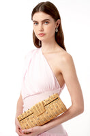 Natural wicker Paloma Raffaia evening clutch by Emm Kuo featuring a compact design and woven texture.