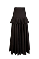 Nara Niro peplum maxi skirt in flowing fabric, featuring a fitted waist and flared hem, perfect for elegant summer outfits.