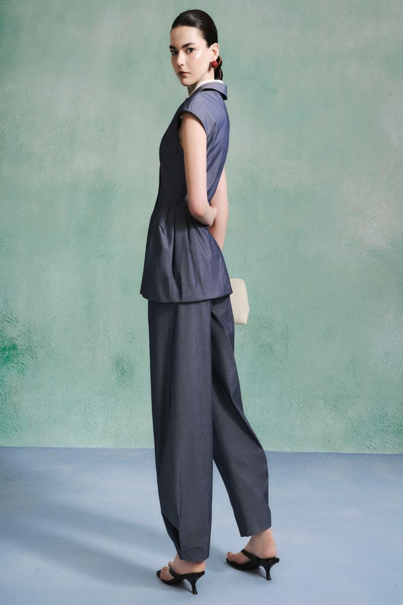 Leica curved pants featuring a relaxed fit, shown with a peplum top, in a stylish, modern design perfect for casual wear.