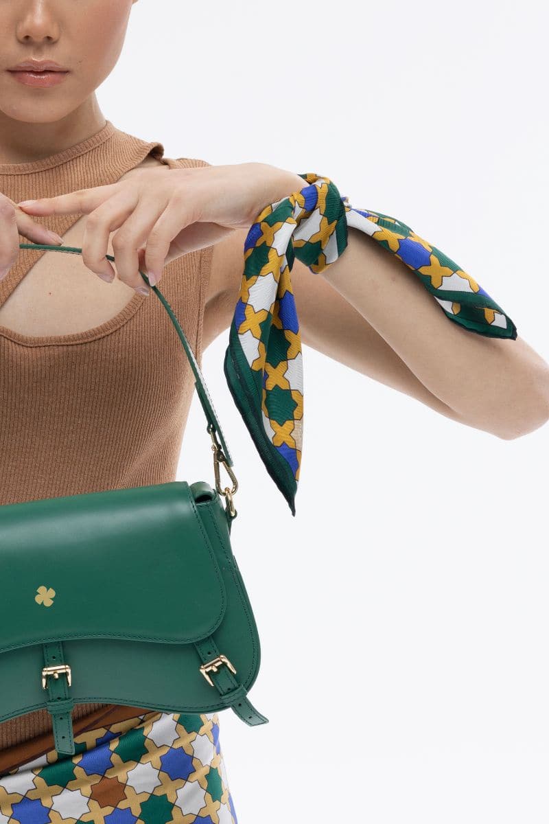 Multicolored green geo-star silk scarf by PHERAHS with intricate geometric patterns and lightweight, elegant fabric.