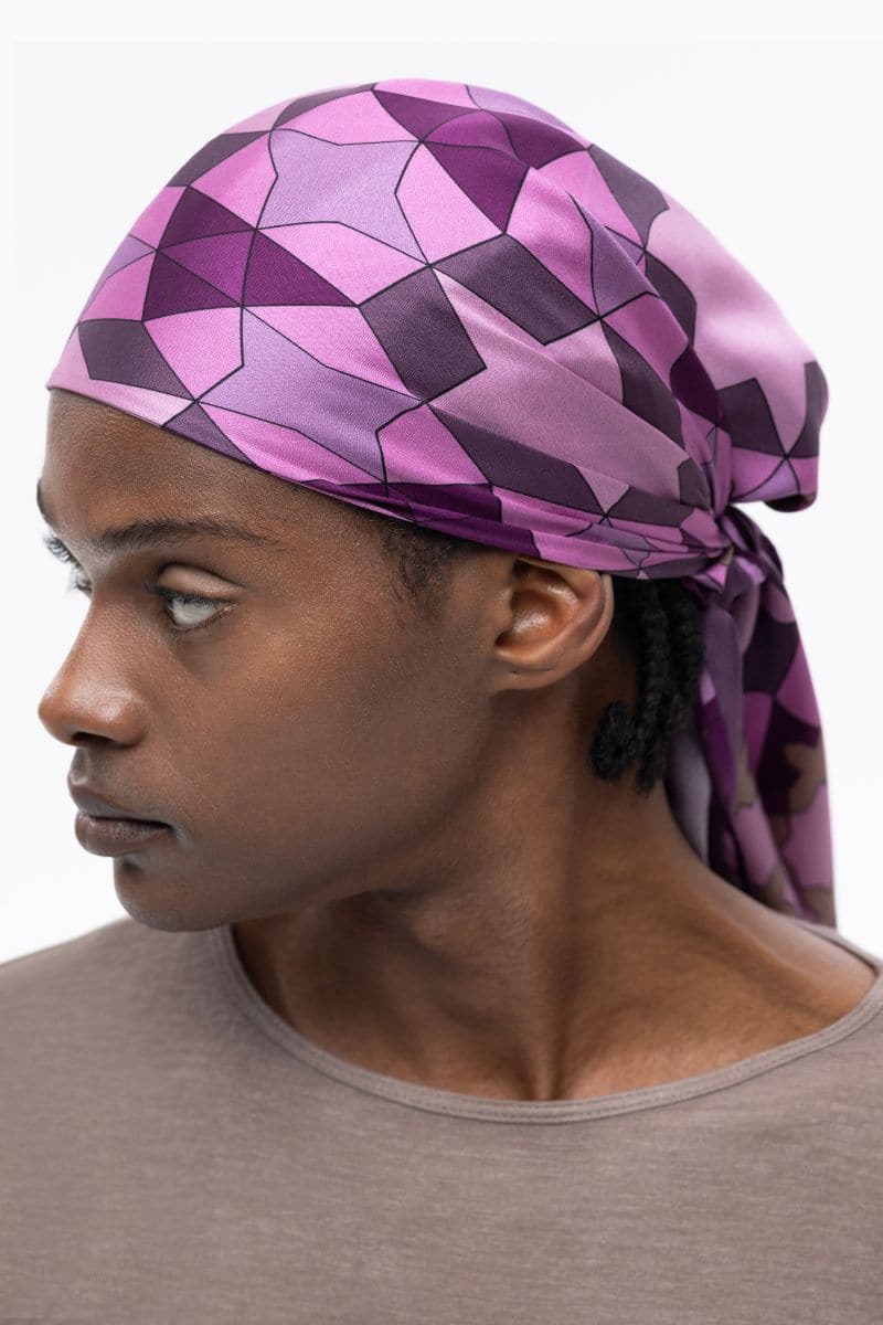 Multicolor pink Geo-Star silk scarf by PHERAHS featuring intricate geometric patterns and soft, luxurious fabric.