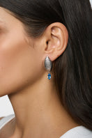 Silver Candy Earrings by Poché featuring playful, curved candy-shaped design perfect for stylish accessories.
