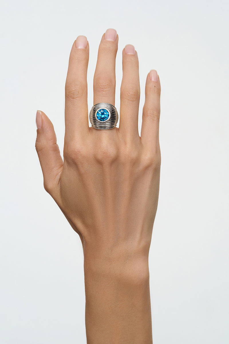 Silver candy ring by Poché, featuring a shiny, sculpted design, perfect as a stylish and playful jewelry accessory.