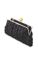 Open black satin clutch with pomegranate embroidery by Sarah's Bag, featuring classic smocking and elegant design.