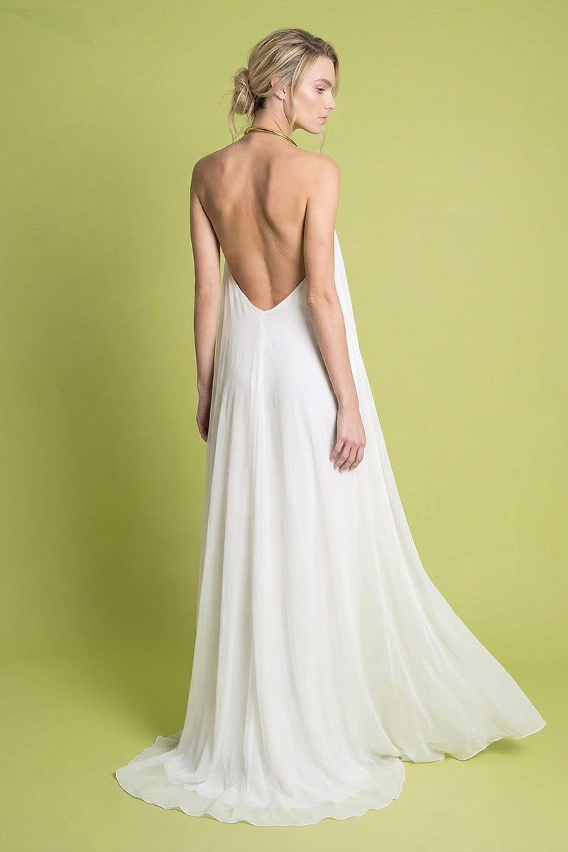 Laura Escobar Portobello ivory maxi dress with flowing fabric and elegant design, shown from the back in this image.