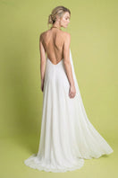 Ivory Portobello maxi dress by Laura Escobar, flowing fabric, back view showing elegant design and lightweight style.