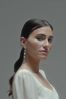 LES BOUCLES D'OREILLES EN ARGENT JUSTICE
