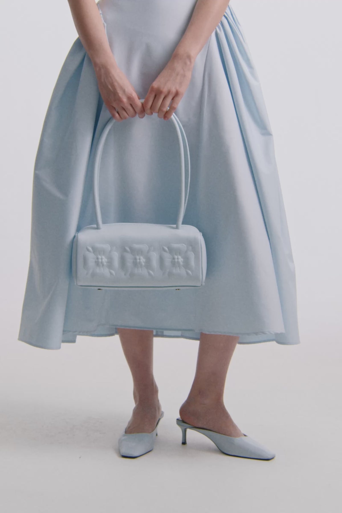 BAS RELIEF BAG IN ICE BLUE